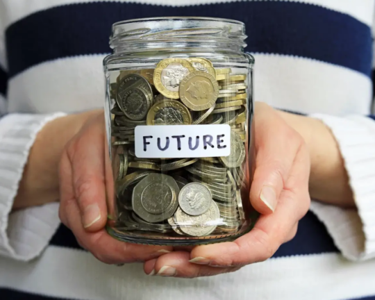 future on jar of coing in hand